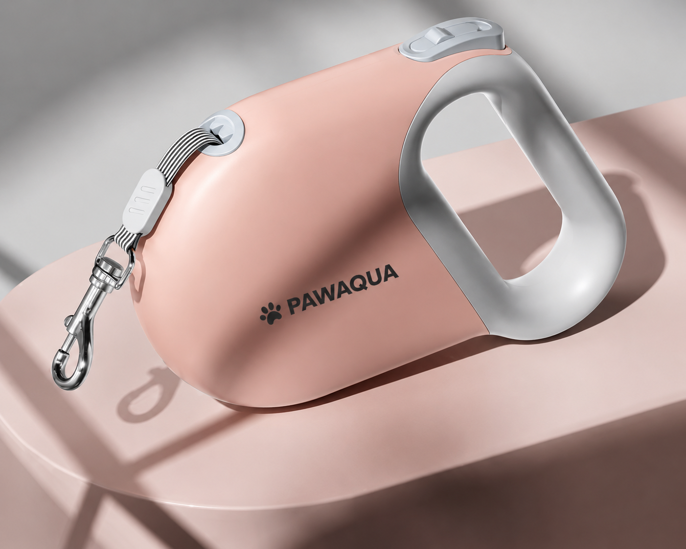 Pink Pawaqua retractable dog leash with ergonomic grip and metal clip