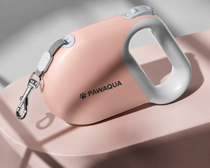 Pink Pawaqua retractable dog leash with ergonomic grip and metal clip
