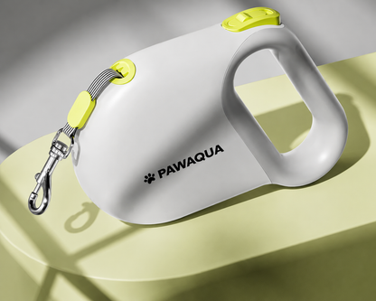 White Pawaqua retractable dog leash with lime accents and ergonomic handle